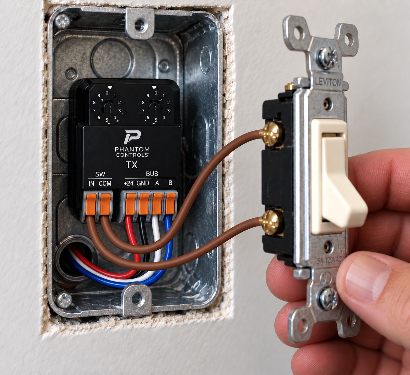 Phantom-TX installed behind a traditional latching dry-contact wall switch